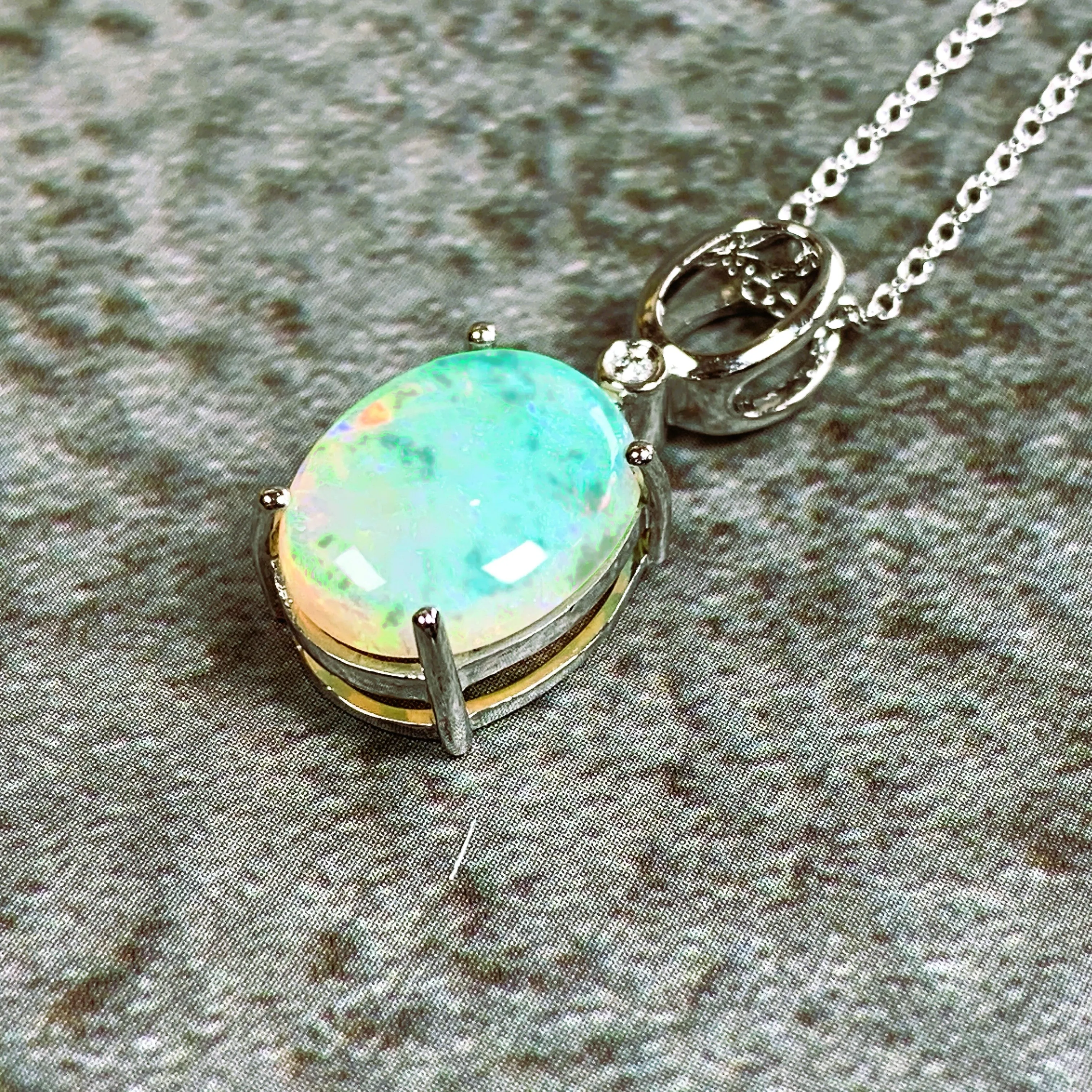 14kt White Gold 2.72ct Crystal Opal and 0.02ct Diamond pendant